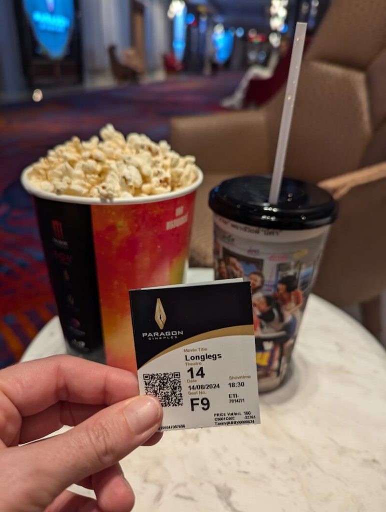 A movie ticket stub with popcorn and a soda at Siam Paragon