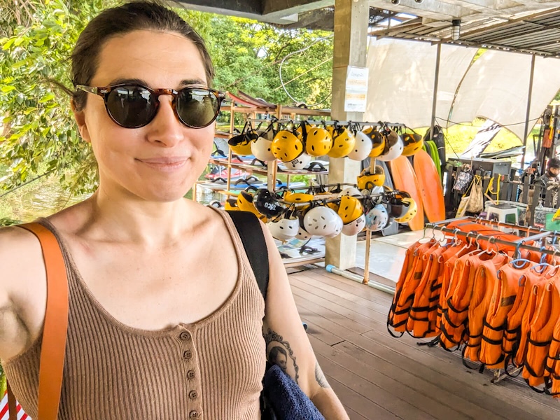 Allison Green at the entrance to Taco Lake with life vests and helmets shown