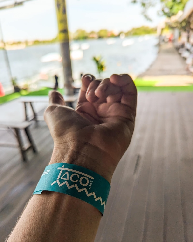 Wakeboarding day pass wristband on Allison's wrist