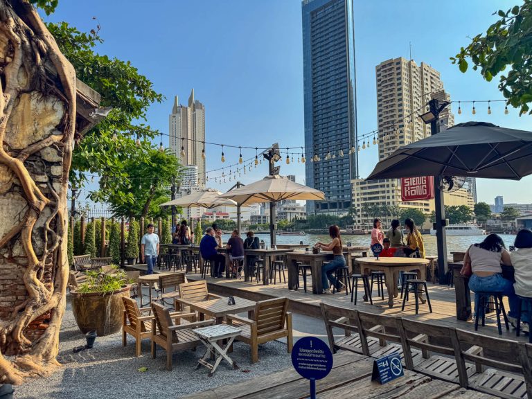 Some of the riverside seating in the Hong Sieng Kong overlooking the main river in Bangkok with late afternoon sunlight