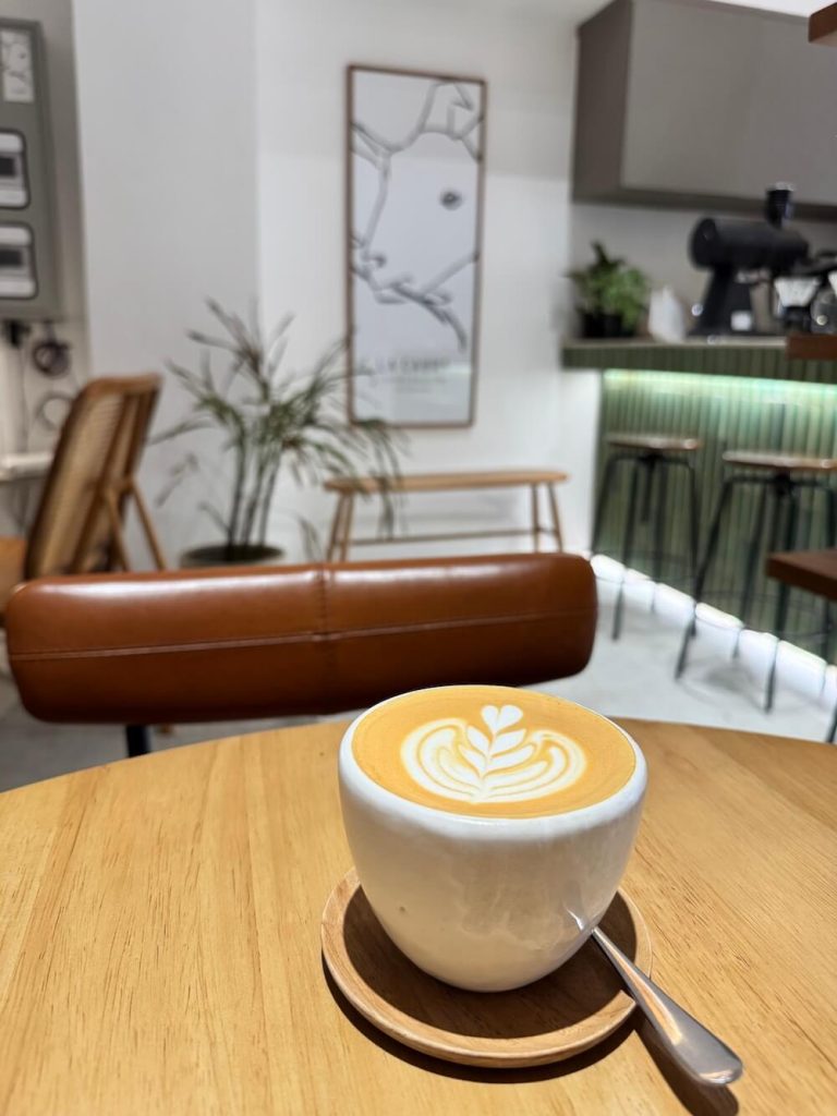 A flat white in a cup without a handle at La Cabra in Bangkok in Talat Noi with hipster Scandinivian ambiance