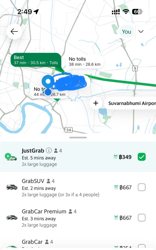 app view of someone using the grab taxi app to get from downtown bangkok to bkk airport