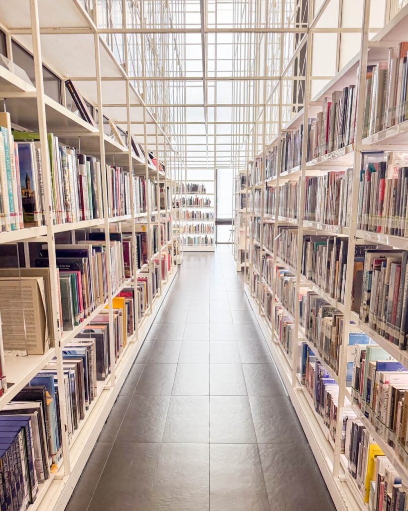 Bookcase and study areas of the library filled with design books