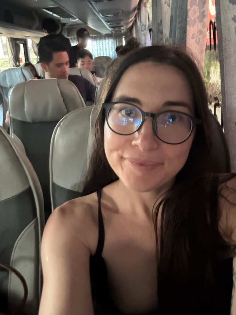 Allison Green happily sitting on the bus on the way to Hua Hin which is a comfortable and lovely experience