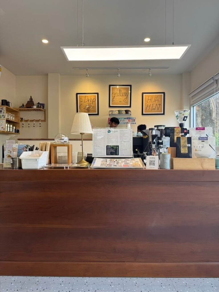 Coffee shop in Hua Hin with white aesthetic and posters