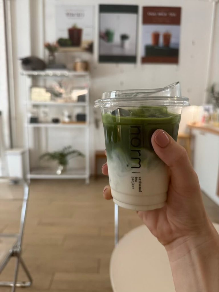 Matcha latte with milk on bottom and matcha on top