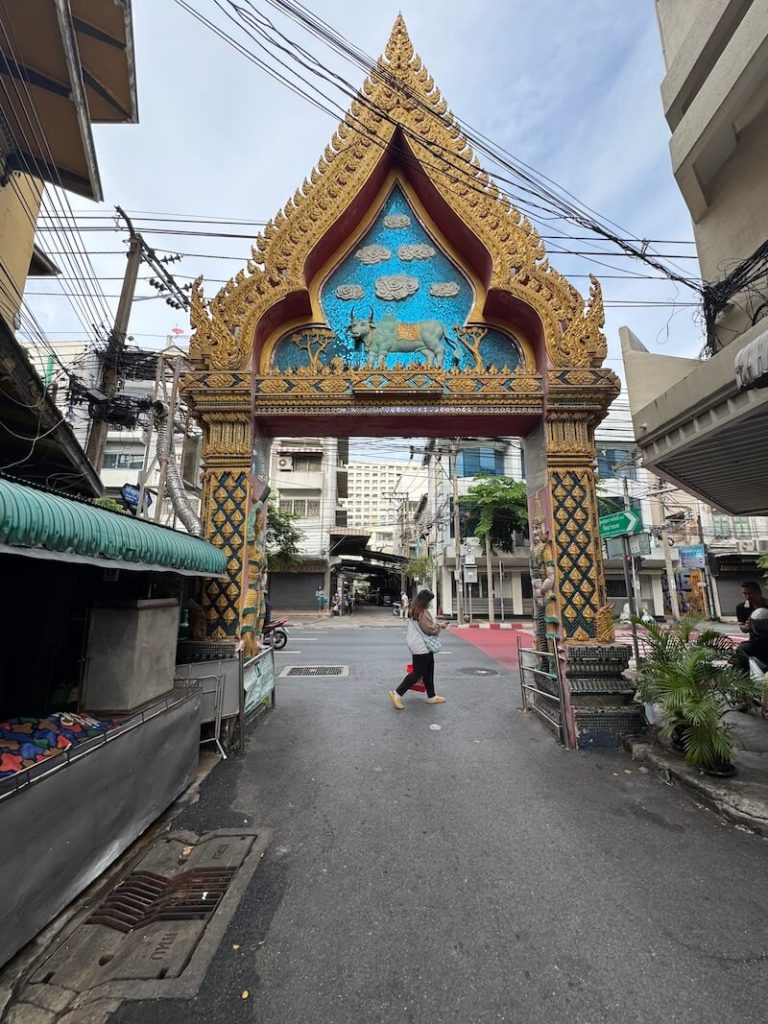 Some clouds and some blue sky in August in Bangkok with a temple gate